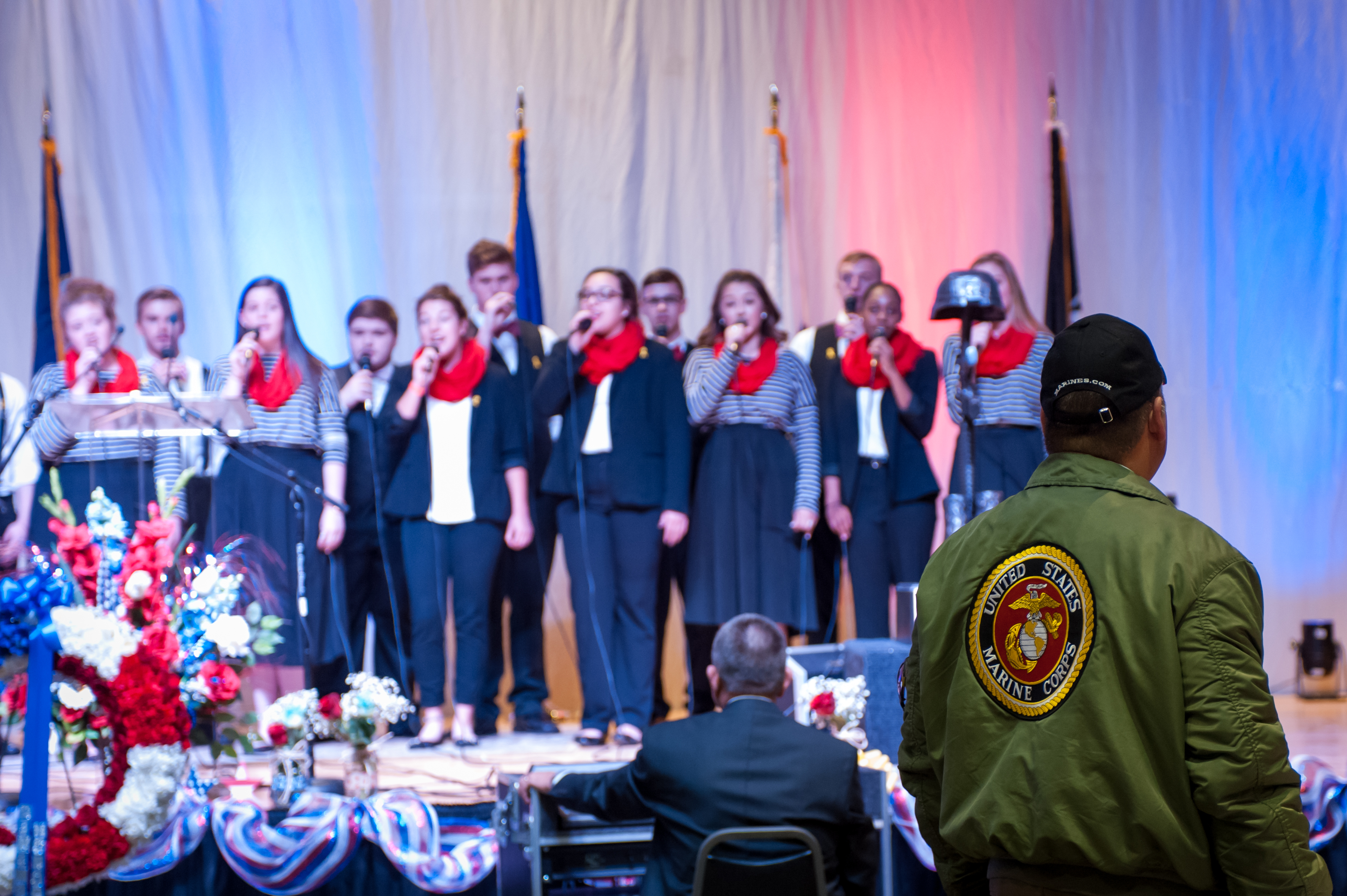 Shaie Williams for AGN Media. US Marine stands during the Armed Forces medley song. The song was sung by Tascosa Freedom Singers during the Armed Forces Day Banquet  in Amarillo, TX Held at the Amarillo Civic Center on May 21, 2016.