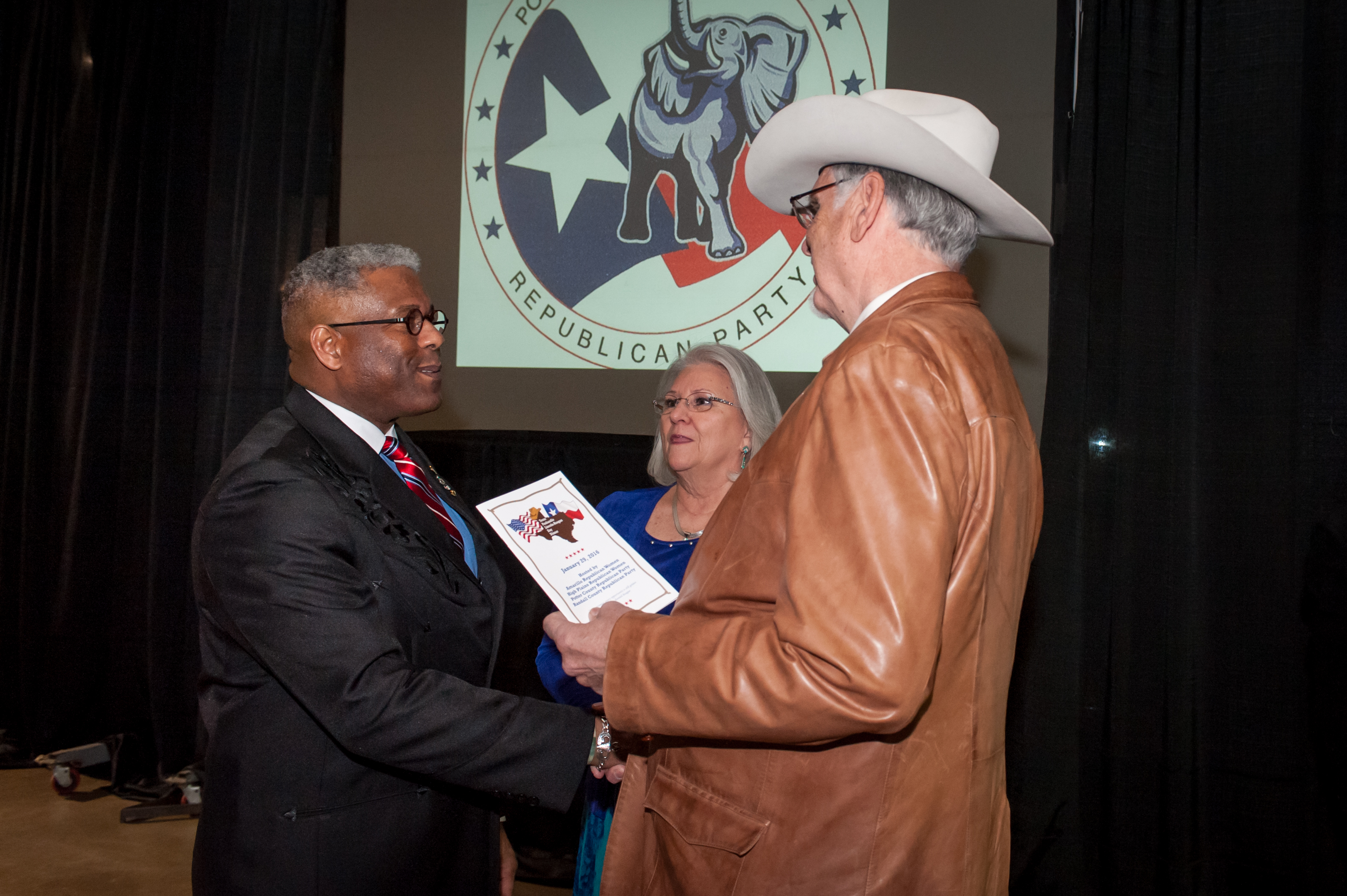 Shaie Williams for AGN Media. Lt. Colonel Allen West with Linda and Tom Hicks at the Texas Panhandle Lincoln-Reagan Day Dinner hosted by the local Republican party groups held at The Rex Baxter Building in Amarillo, TX on January 29, 2016