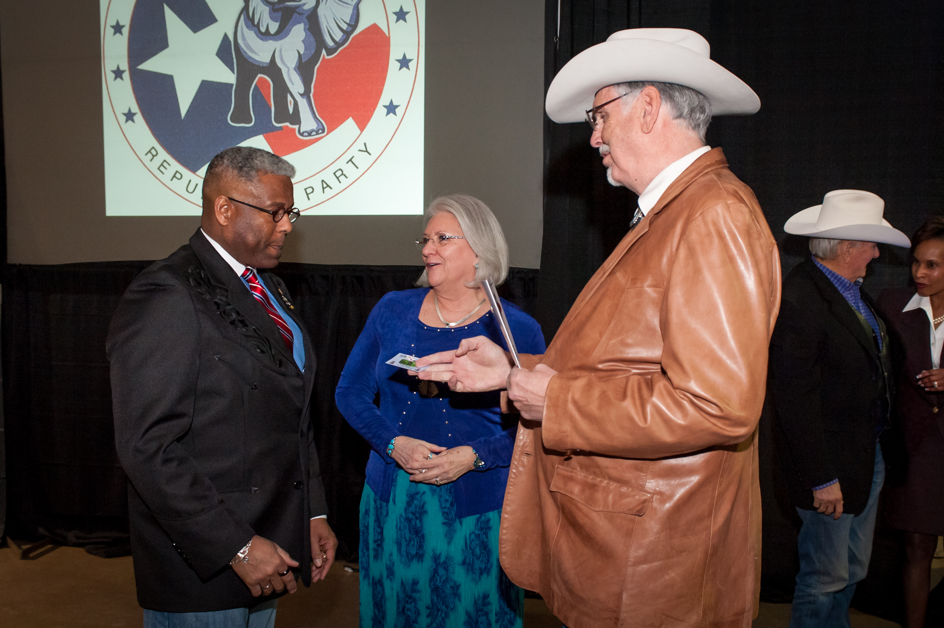 Shaie Williams for AGN Media. Lt. Colonel Allen West with Linda and Tom Hicks at the Texas Panhandle Lincoln-Reagan Day Dinner hosted by the local Republican party groups held at The Rex Baxter Building in Amarillo, TX on January 29, 2016